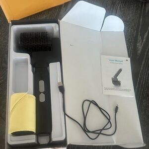 Black rechargeable Cordless BBQ Grill Brush with Yellow Cloth